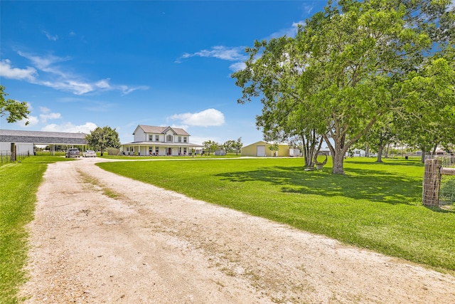 view of home's community featuring a lawn