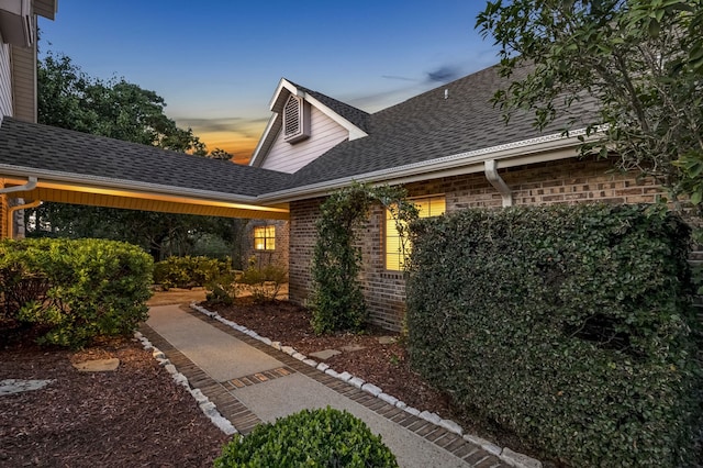 view of property exterior at dusk