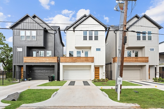 townhome / multi-family property featuring a balcony and a garage