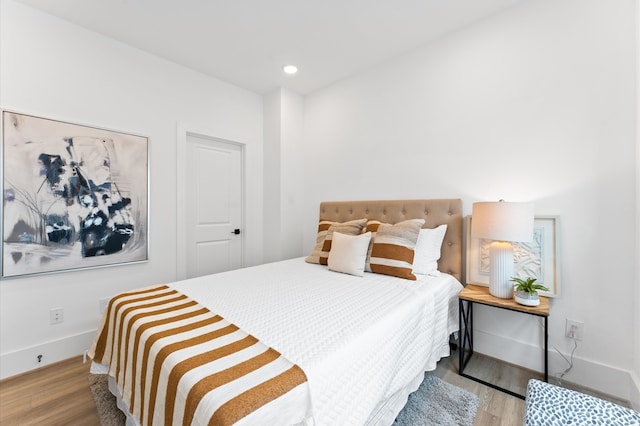 bedroom with light hardwood / wood-style floors