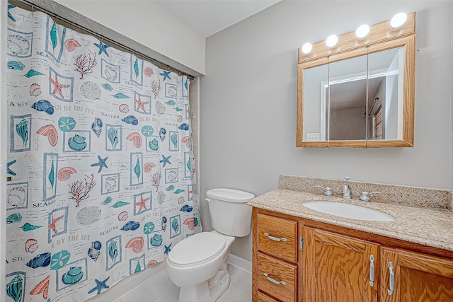 bathroom featuring curtained shower, vanity, tile patterned floors, and toilet