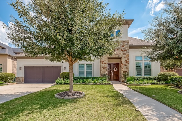 view of front of home featuring a garage and a front yard