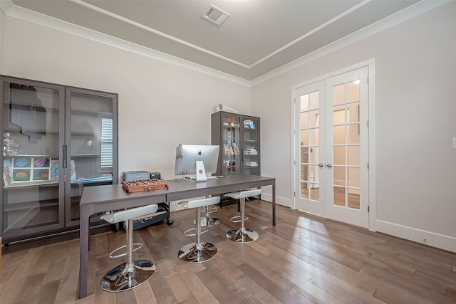 home office featuring french doors, ornamental molding, and wood-type flooring