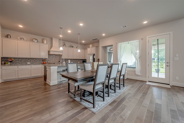 dining room featuring light hardwood / wood-style floors and sink