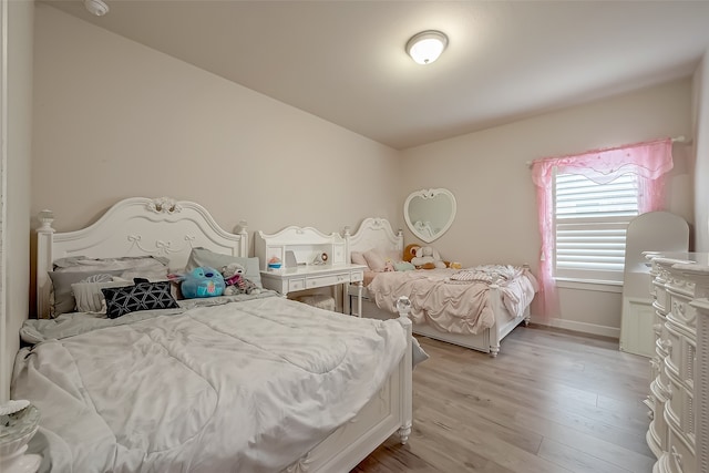 bedroom with light wood-type flooring