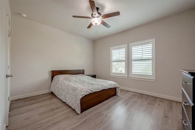 bedroom featuring light hardwood / wood-style floors and ceiling fan