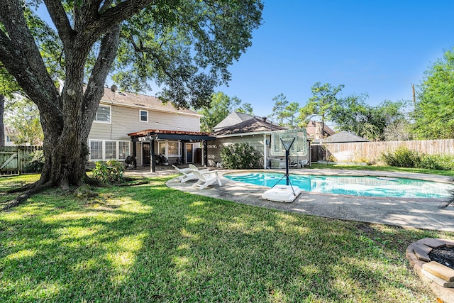 view of swimming pool featuring a patio and a lawn