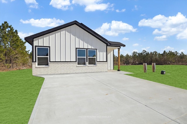 view of home's exterior with a yard