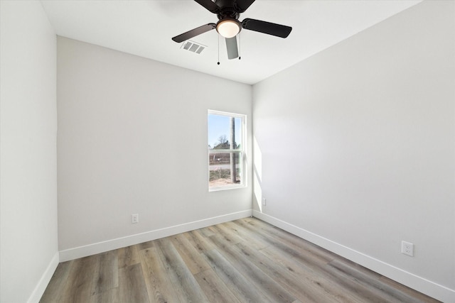 spare room with ceiling fan and light hardwood / wood-style flooring