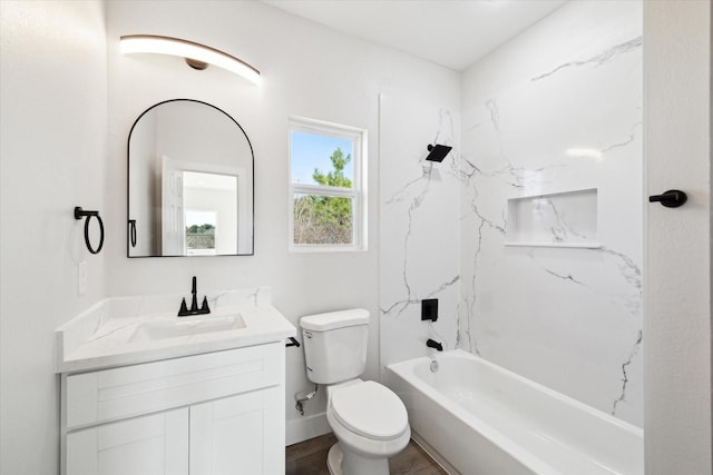 full bathroom featuring hardwood / wood-style floors, vanity, shower / bathtub combination, and toilet