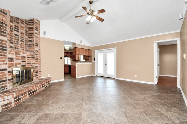 unfurnished living room with lofted ceiling with beams, french doors, ornamental molding, a brick fireplace, and ceiling fan