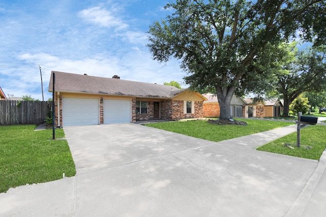 ranch-style house with a garage and a front yard