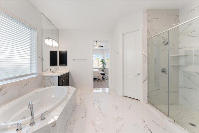 bathroom featuring ceiling fan, vanity, and separate shower and tub