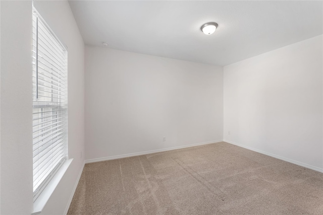 unfurnished room featuring carpet flooring