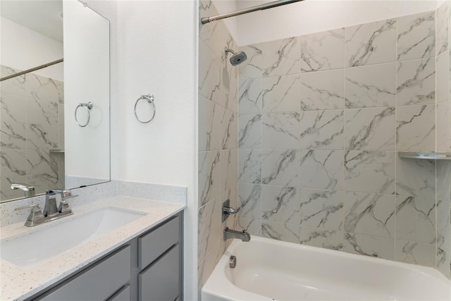 bathroom featuring vanity and tiled shower / bath combo