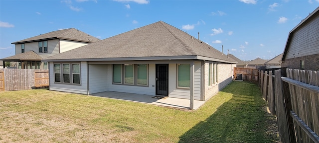 back of property with cooling unit, a patio area, and a lawn