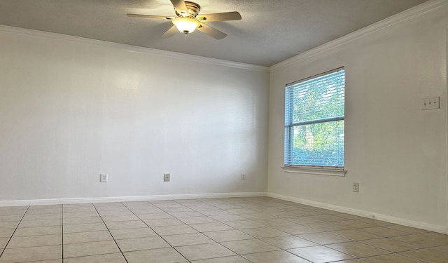 tiled spare room featuring ceiling fan, a textured ceiling, and ornamental molding