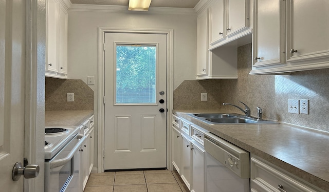 kitchen featuring decorative backsplash, white cabinetry, sink, and white appliances