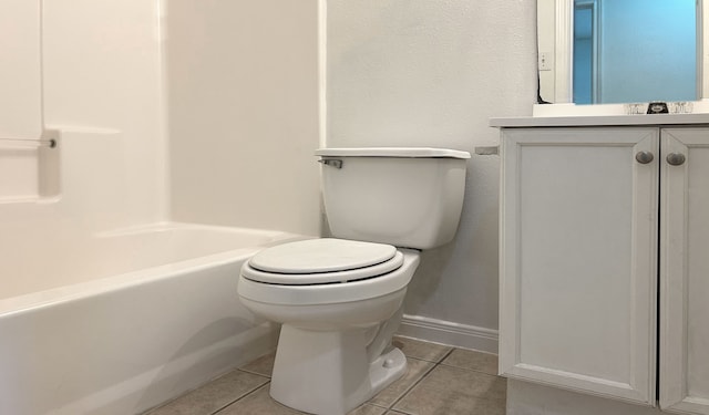 full bathroom featuring toilet, vanity, tile patterned floors, and tub / shower combination