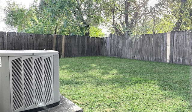 view of yard with central AC