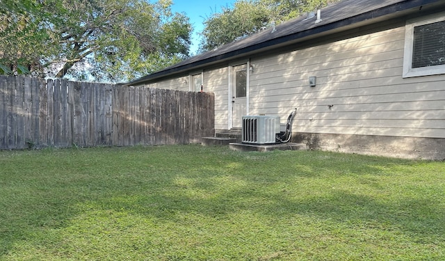 view of yard with central AC unit