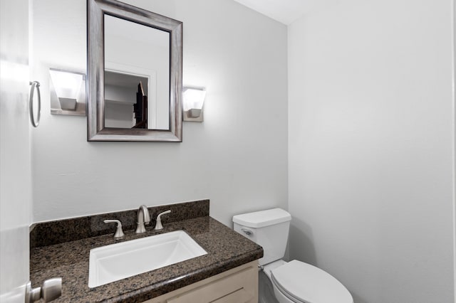 bathroom with toilet and vanity