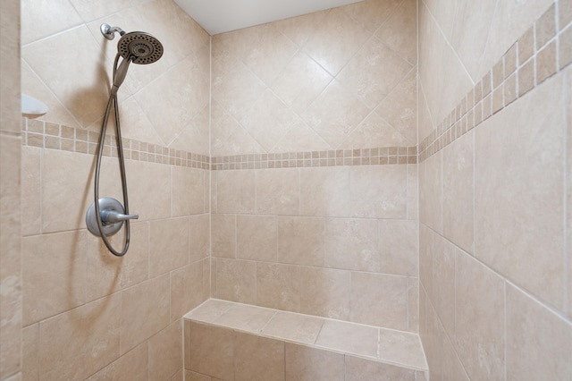 bathroom with a tile shower