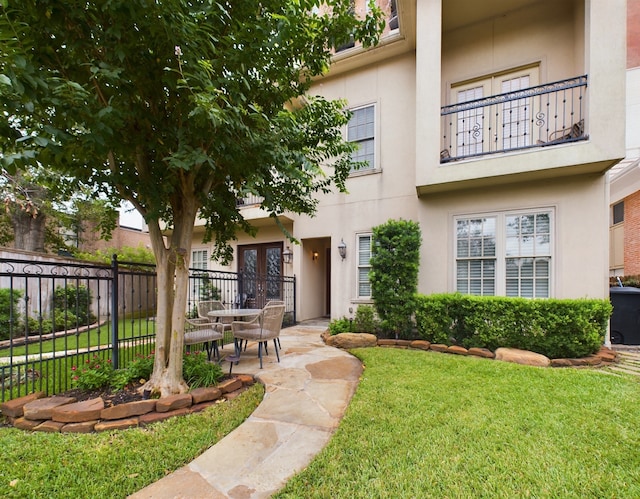 exterior space with a lawn and a patio