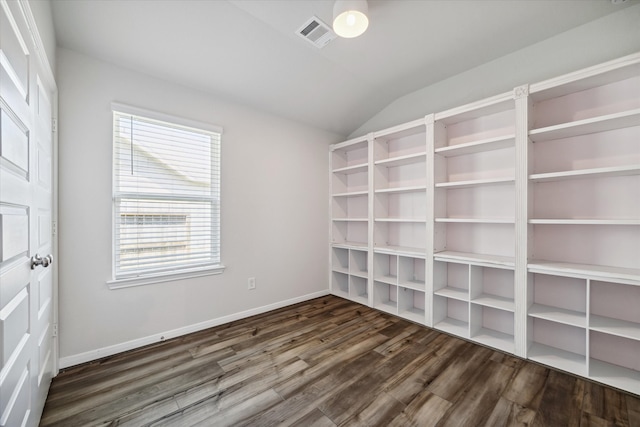 unfurnished room with dark hardwood / wood-style flooring and lofted ceiling