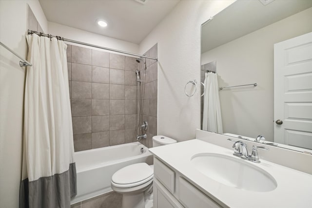 full bathroom with vanity, shower / bathtub combination with curtain, and toilet