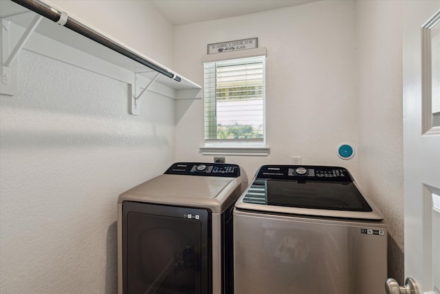 laundry area with separate washer and dryer