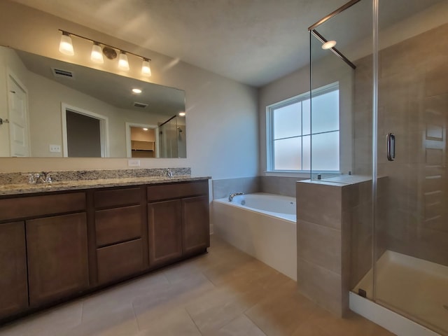 full bath featuring visible vents, double vanity, a shower stall, a garden tub, and tile patterned floors