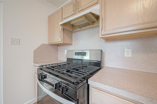 kitchen with decorative backsplash, custom exhaust hood, crown molding, stainless steel gas range, and light brown cabinetry