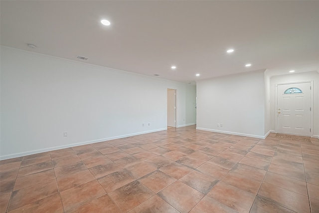 spare room featuring ornamental molding