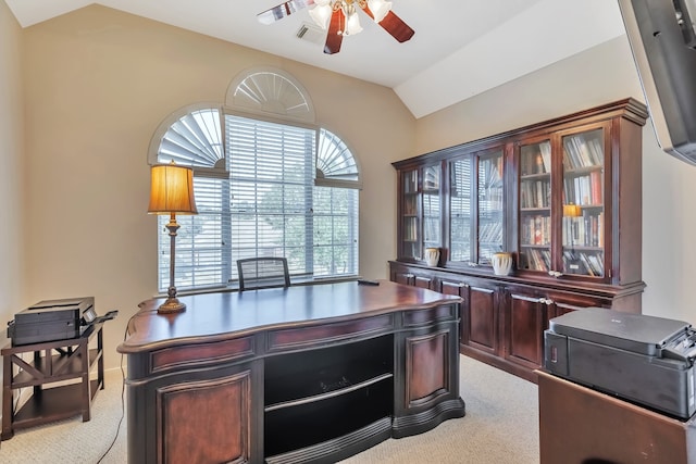 carpeted office featuring lofted ceiling and ceiling fan