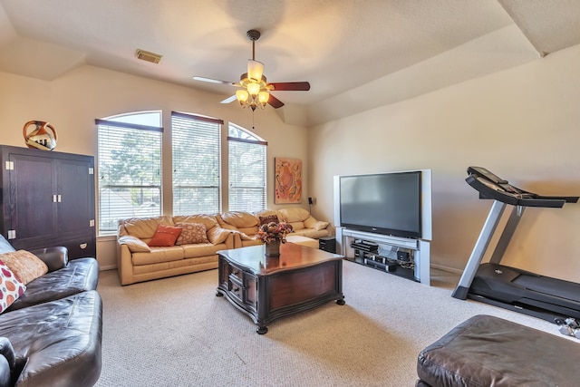 living room with light colored carpet, lofted ceiling, and ceiling fan