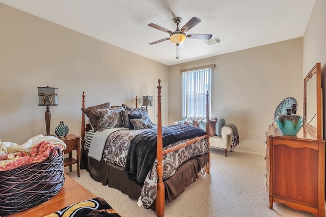 bedroom with ceiling fan and light carpet