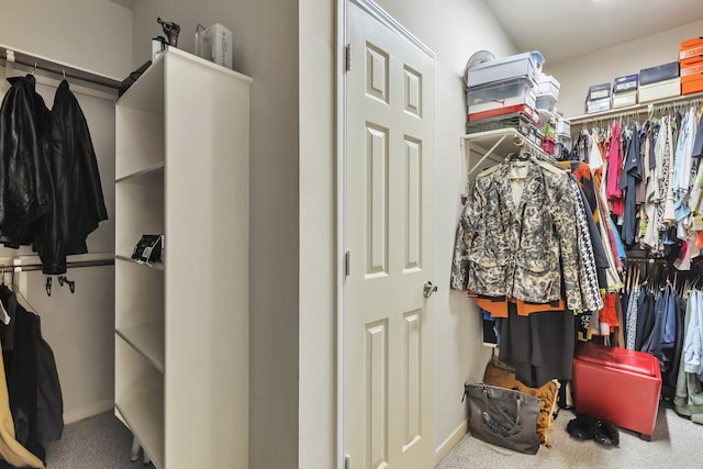 spacious closet with carpet floors