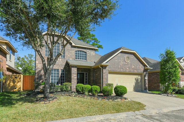 view of front of property with a garage and a front yard