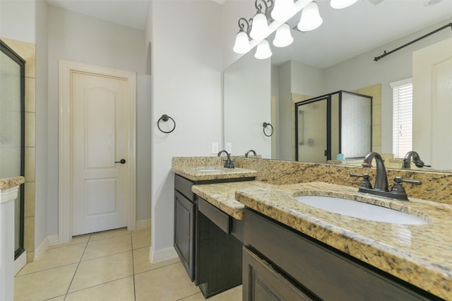 bathroom featuring vanity, tile patterned flooring, and an enclosed shower