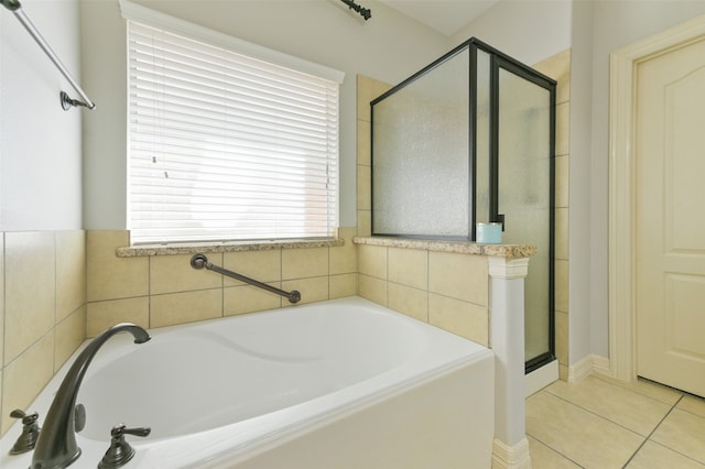 bathroom featuring plus walk in shower and tile patterned floors