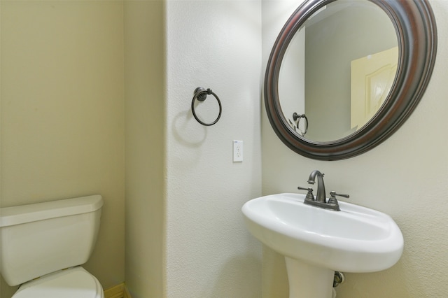 bathroom with sink and toilet