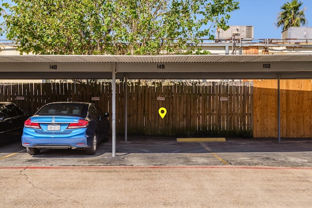 view of vehicle parking featuring a carport