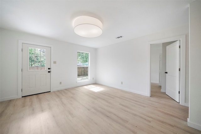 foyer entrance with light wood-type flooring