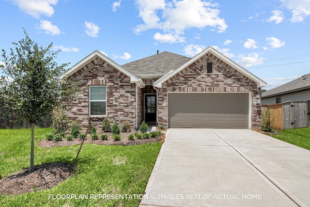 view of front of property with a garage and a front lawn