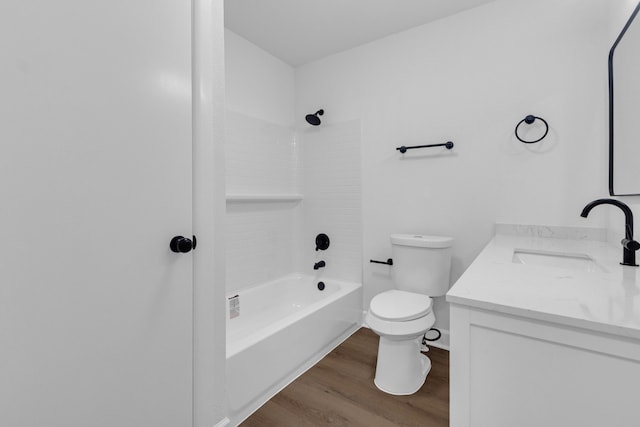 full bathroom with toilet, vanity, wood-type flooring, and shower / washtub combination