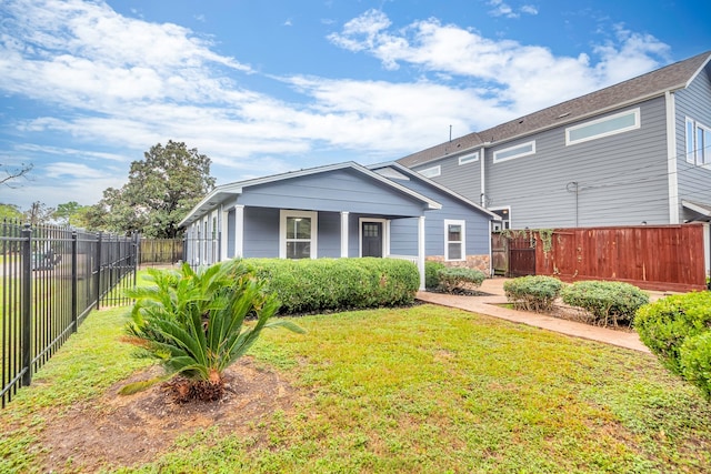 rear view of house with a yard