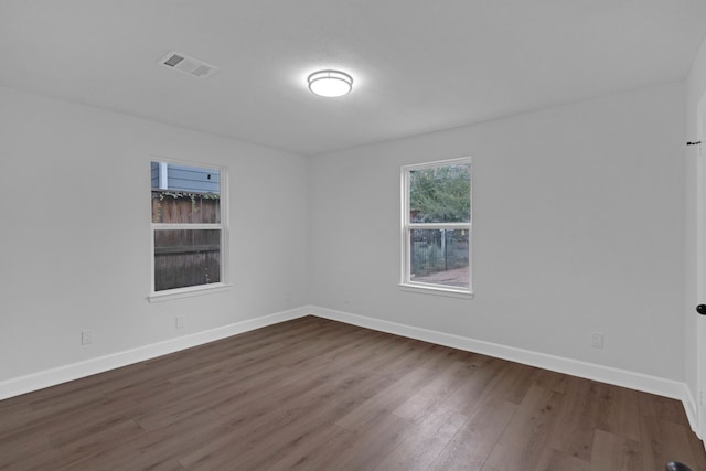 spare room featuring hardwood / wood-style flooring