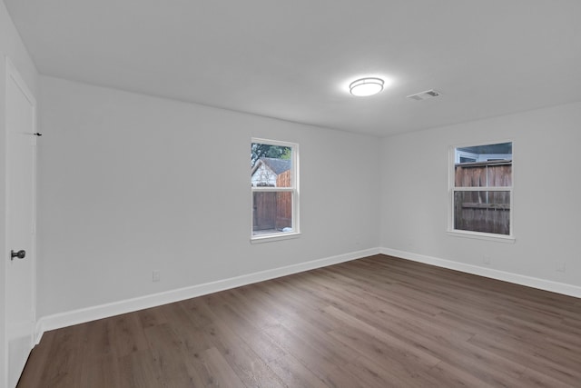 spare room featuring hardwood / wood-style floors