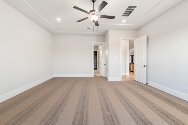 unfurnished bedroom featuring ceiling fan and light carpet